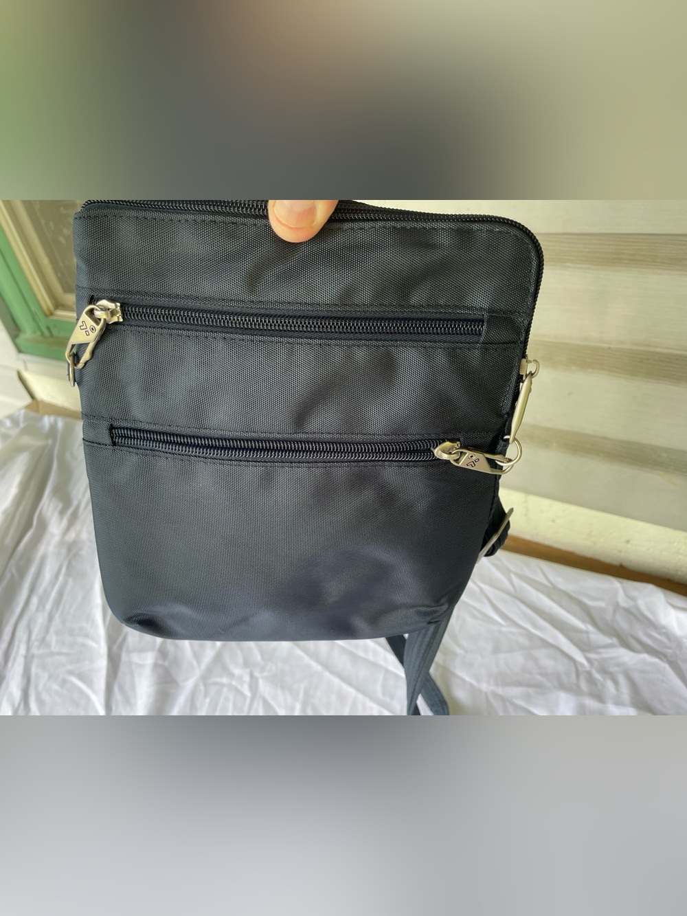 Travelon Navy Blue Crossbody Bag with locking Zip Pockets and Tan Liner